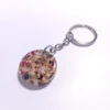 KEYCHAIN-0007 (2) Μπρελόκ στρογγυλό με πέταλα λουλουδιών & φύλλα χρυσού