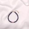 Βραχιόλι με μαύρα μαργαριτάρια & 1 μπορντό μαργαριτάρι