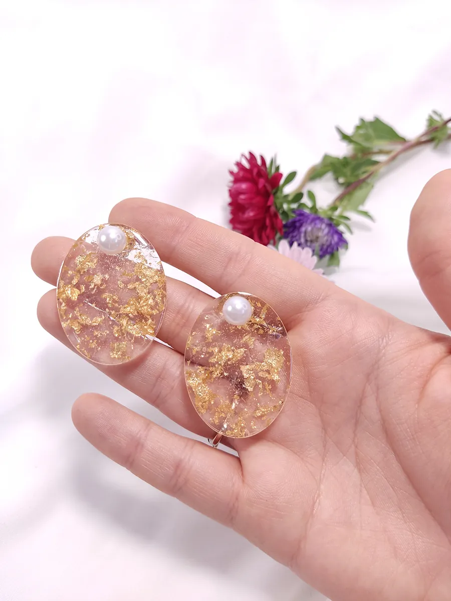 Σκουλαρίκια ατσάλινα με κλιπς  μεγάλα οβάλ με φύλλα χρυσού