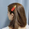 HAIRCLIPS-0016 Κλιπ μαλλιών σε κόκκινο-χρυσό χρώμα
