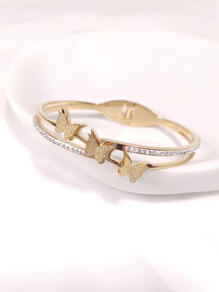 Βραχιόλι χειροπέδα ατσάλινη χρυσή με πεταλούδες