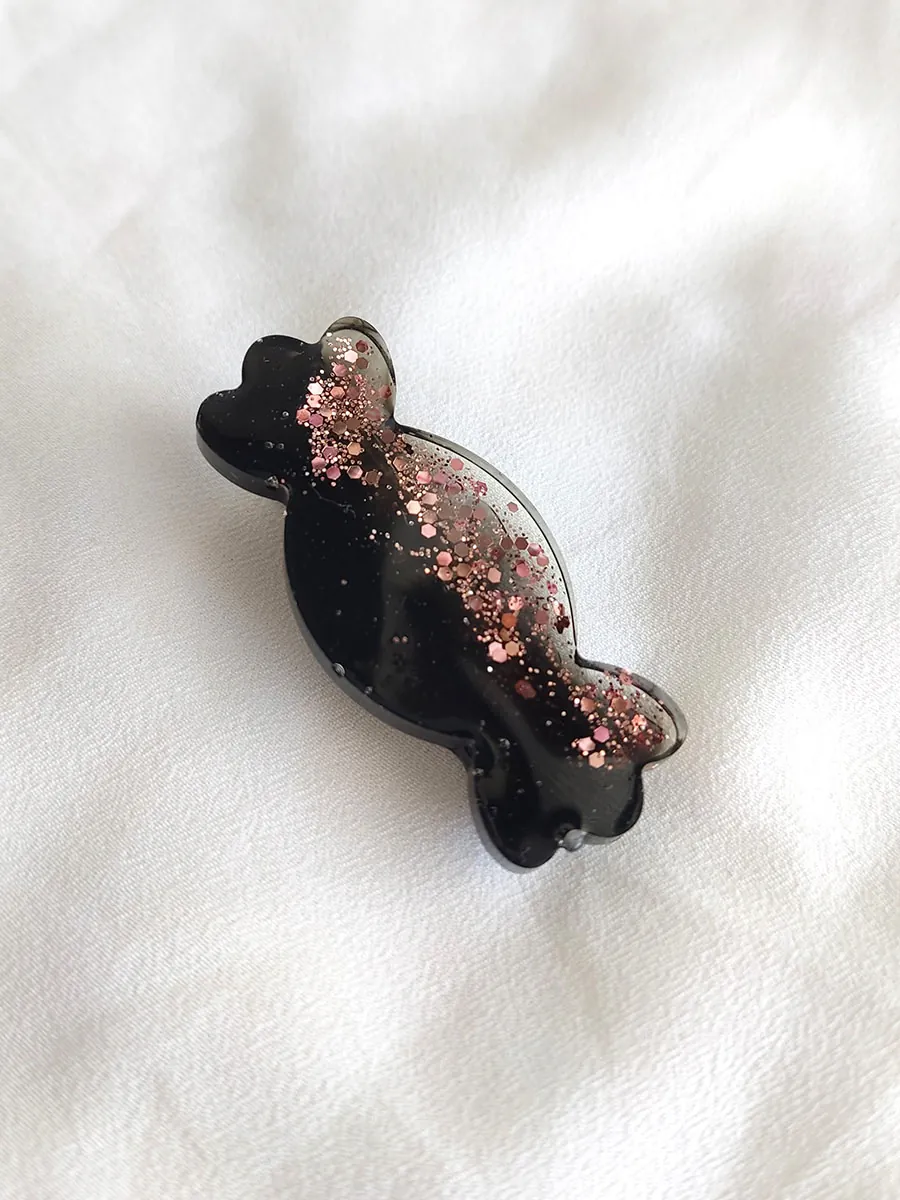 HAIRCLIP-0020-10S Κλιπ μαλλιών καραμελίτσα μαύρη με ροζ glitter