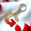 KEYCHAIN-0014 Χειροποίητο Μπρελόκ από Υγρό Γυαλί σε Κόκκινο με Φύλλα Χρυσού – Μονόγραμμα | CHRISARTI
